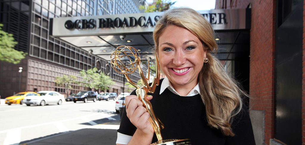 Sunday Morning's Sara Kugel with Emmy in front of CBS