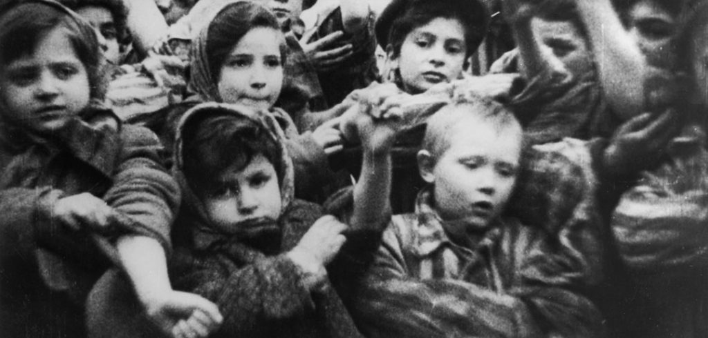 This image of child Holocaust survivors, including 4-year-old Michael Bornstein (in front on the right), is from film footage taken by Soviet soldiers days after they liberated Auschwitz on January 27, 1945. Courtesy of Pańtswowe Muzeum Auschwitz-Birkenau