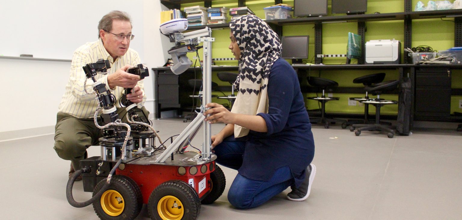 Damian Lyons, Director of Fordham's Robotics and Computer Vision Laboratory, works with his graduate research assistant, Saba Zahra.