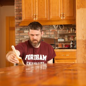 Aubin puts the finishing touches in his new kitchen. 