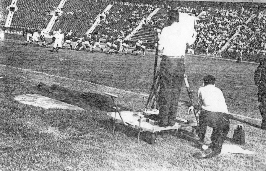 Camera crew on the field at Randall’s Island Stadium for a football gabe between Fordham and Waynesburg College, 1939