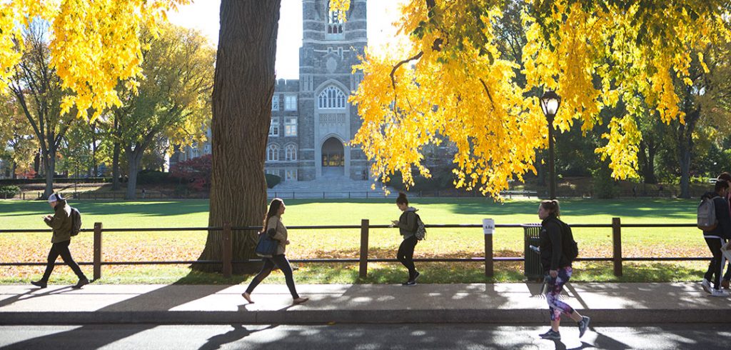 Students walking at Rose Hill with Keating in the background