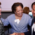 Valerie Rainford introduces two women who shake hands