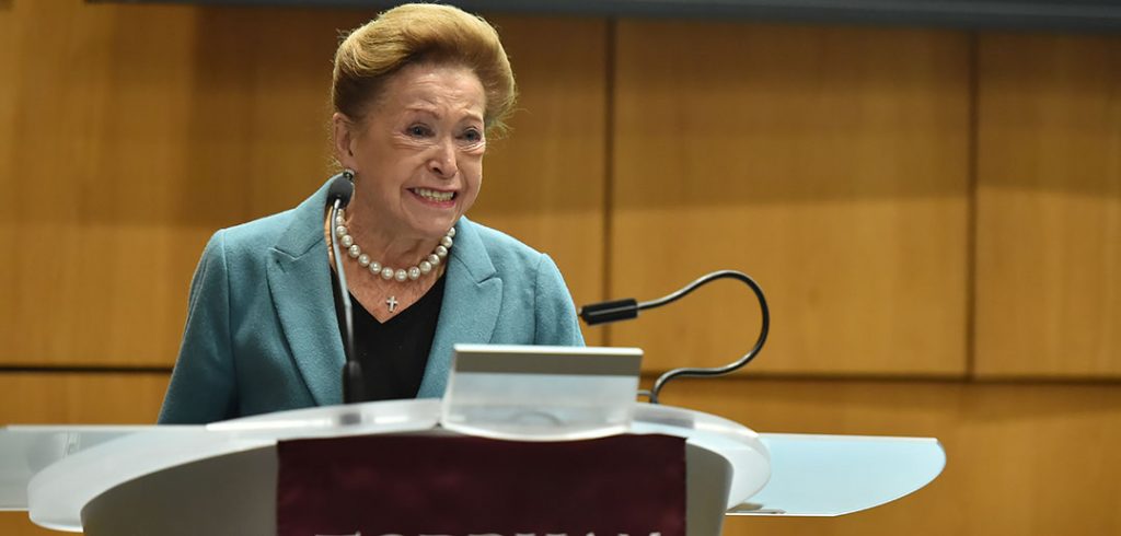 Mary Higgins Clark standing at a podium