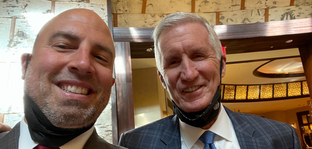 Mike Breen, FCRH ’83 (right), posing with Fordham athletic director Ed Kull at the 2021 Basketball Hall of Fame Curt Gowdy Award ceremony.