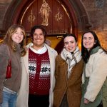Four young women outside church