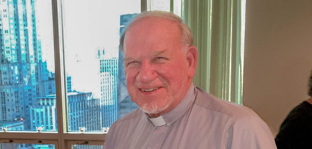 Priest in gray clerical collar