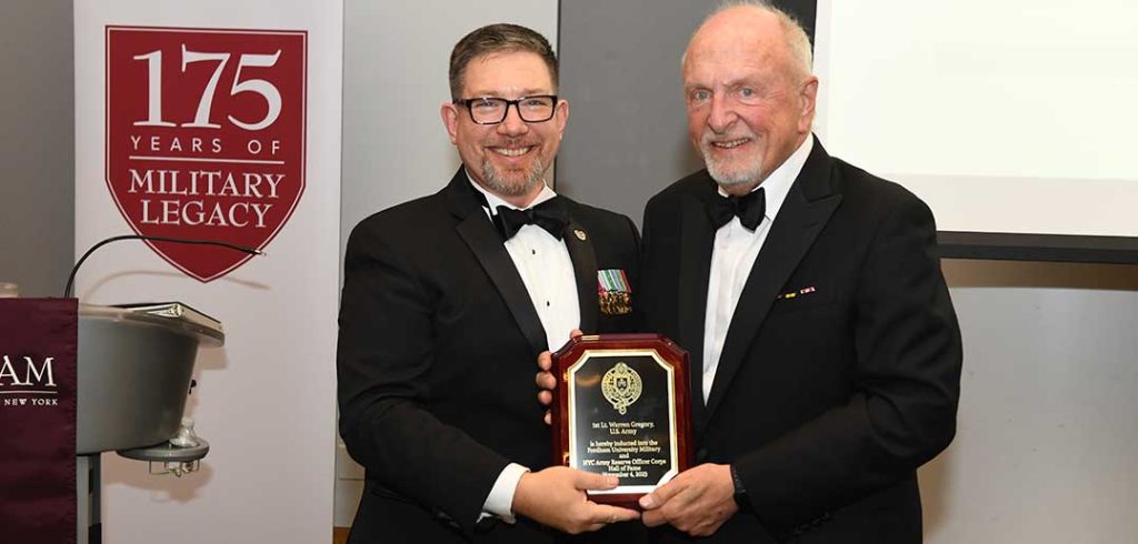 two men holding an award