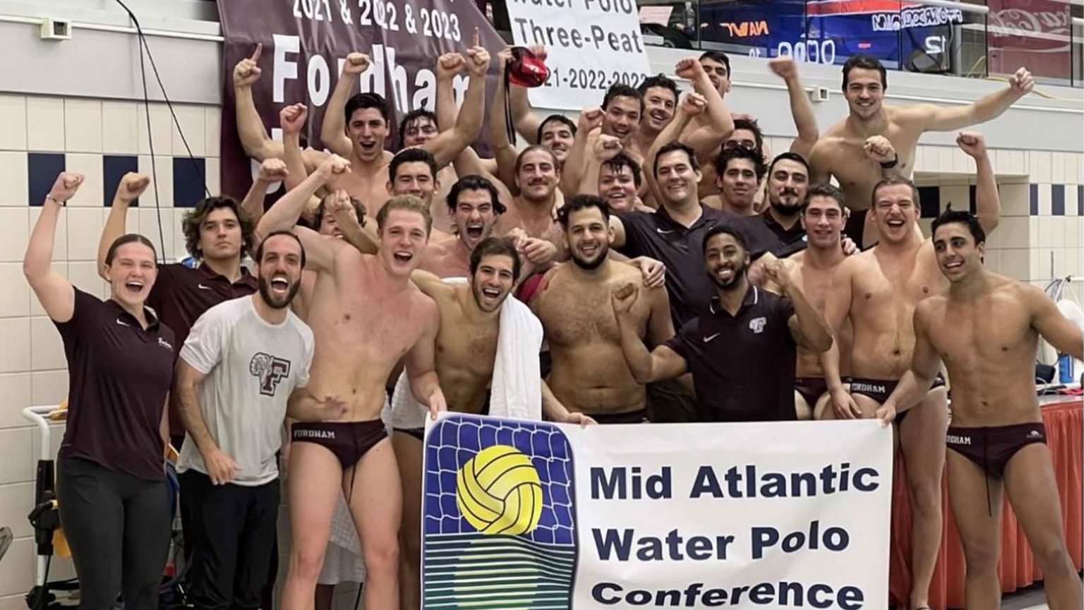 The 2023 Fordham men's water polo team celebrating the MAWPC championships