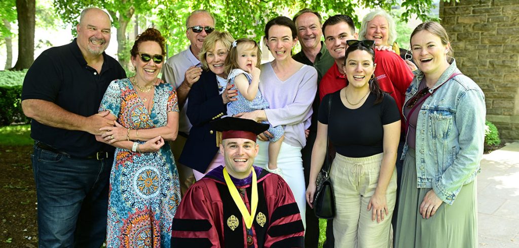 A family poses after graduation