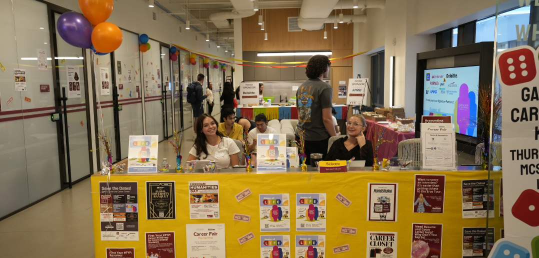 Students working an information table at a career event