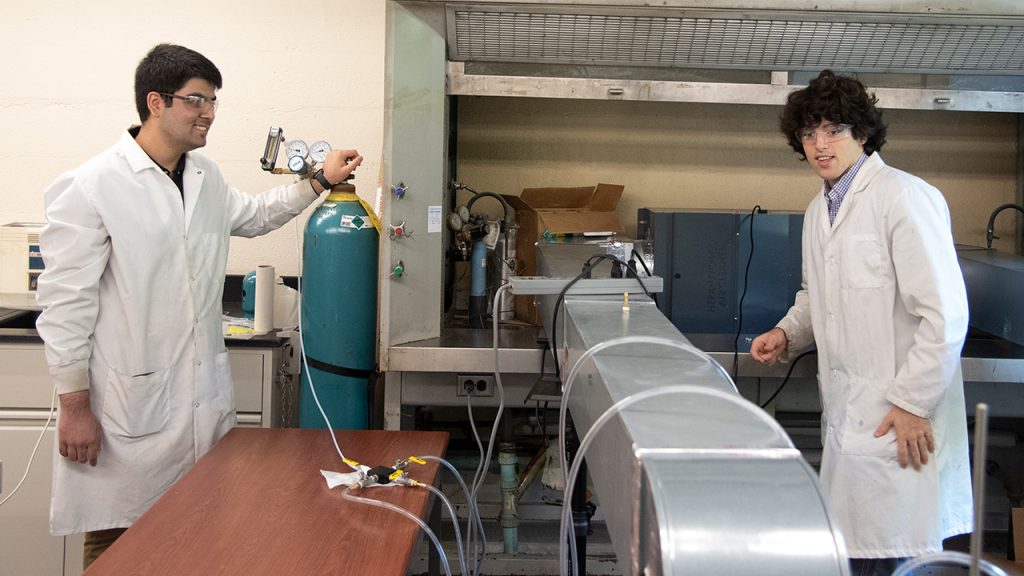 Juniors Arhan Jamshaid (left) and Jack Loughney—neuroscience and biochemistry majors, respectively—working on an air purification project in a Fordham lab.