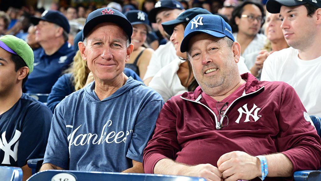 Two Yankee fans sit in the stadium