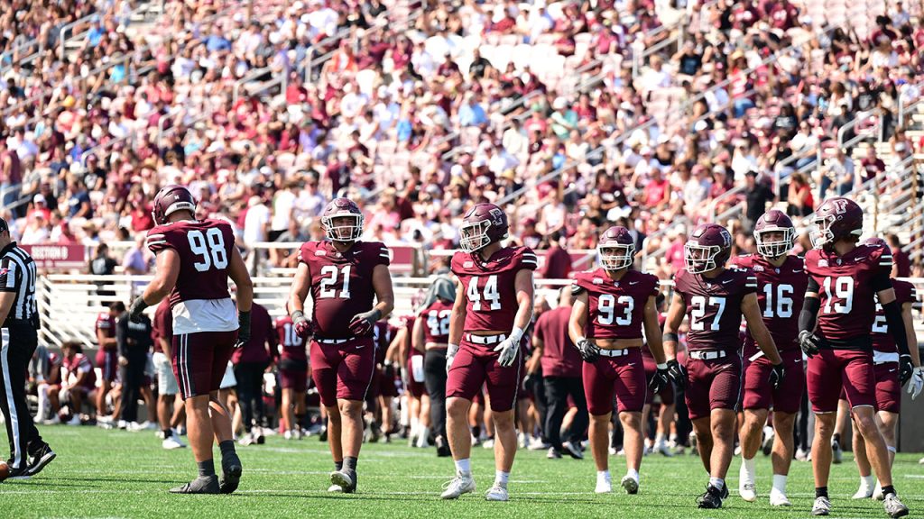 The Fordham football team takes the field at Moglia Stadium.