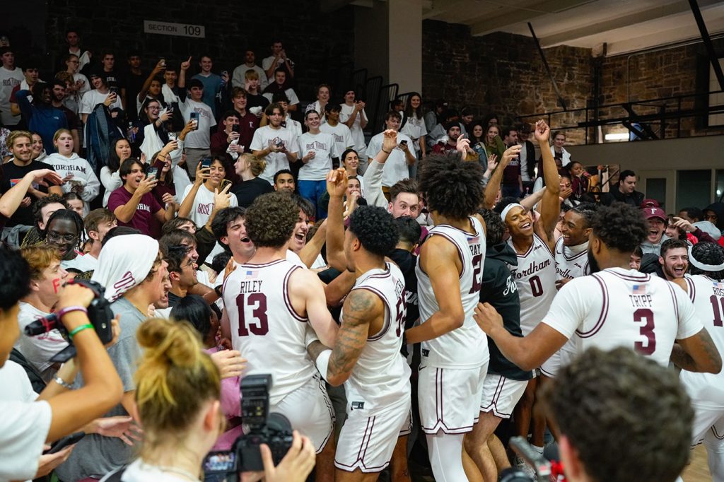 Basketball team celebrates with fans