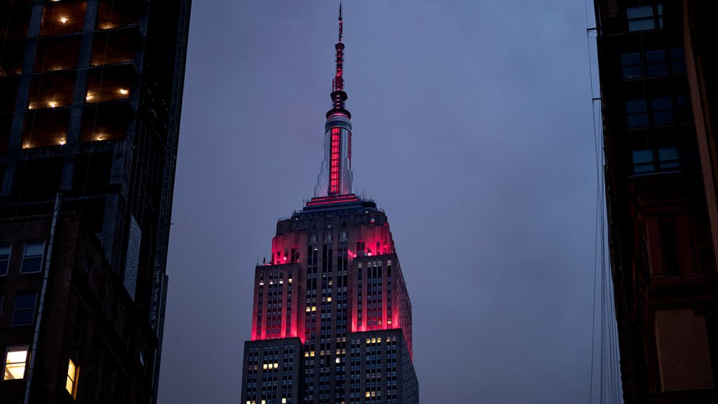 Empire State Building lit maroon.