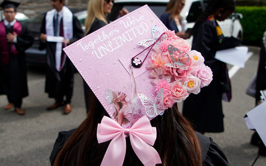 Commencement cap decorated with the message "Together we're unlimited" 