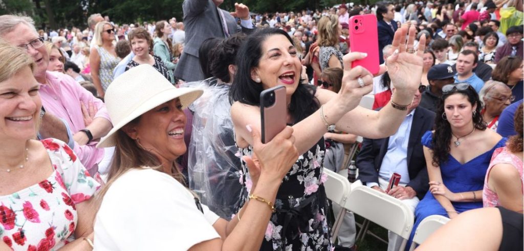 The crowd cheers at Fordham's commencement ceremony.