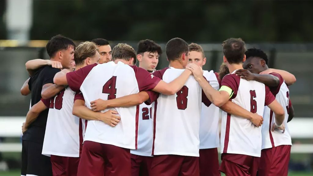 soccer players standing around in a circle
