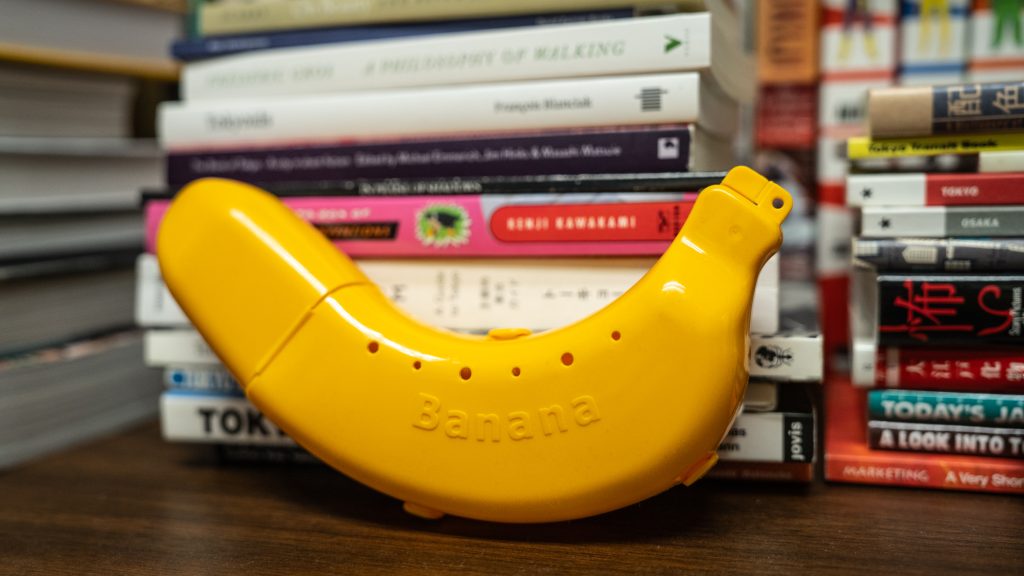 A yellow plastic case shaped like a banana