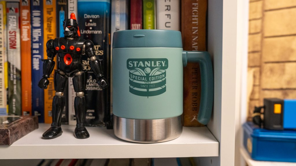 Blue cup imprinted with the word "Stanley"