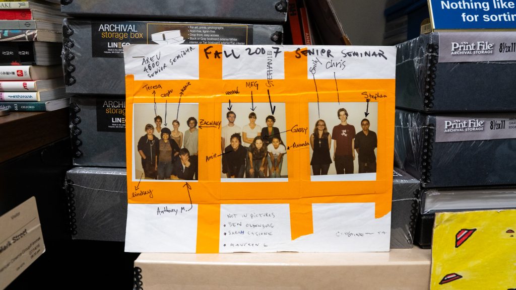 Pictures of students taped on a piece of paper