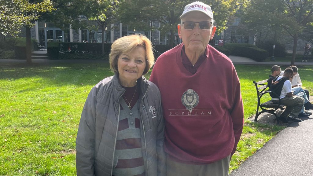 A couple poses for a picture