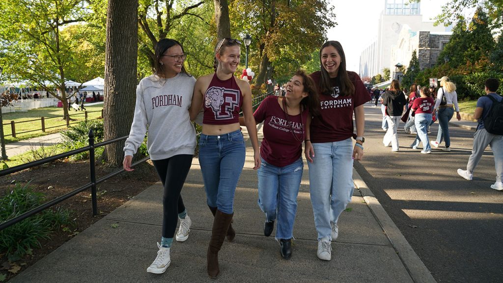 Seen at Homecoming: Fordham Fans’ Vintage Wear Shows Ram Spirit Four people show off their gear