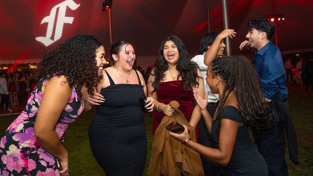 Students dance under the tent