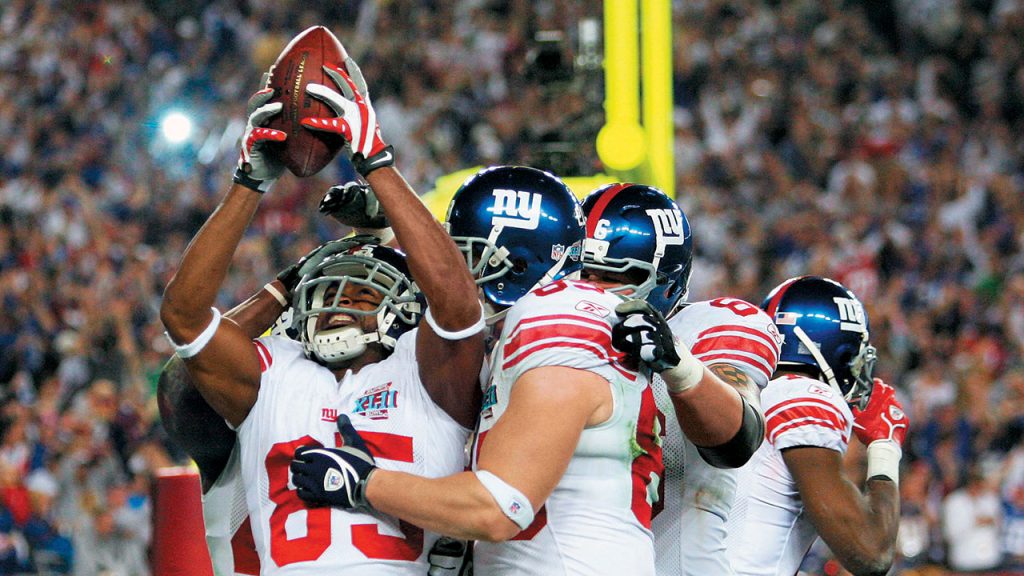 New York Giants wide receiver David Tyree and his teammates celebrate during the team's 17-14 victory in Super Bowl XLII. Photo by Streeter Leak/Getty Images