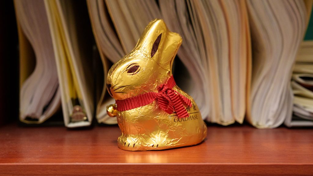 A chocolate bunny wrapped in gold foil