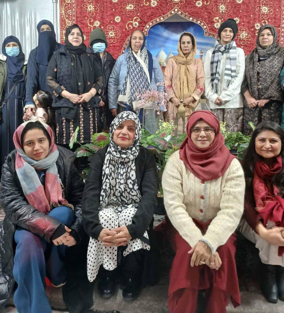 Rahbel Rahman-Tahir, lower right, with residents of Brooklyn's Little Pakistan neighborhood at an event co-hosted by the American Council of Minority Women 