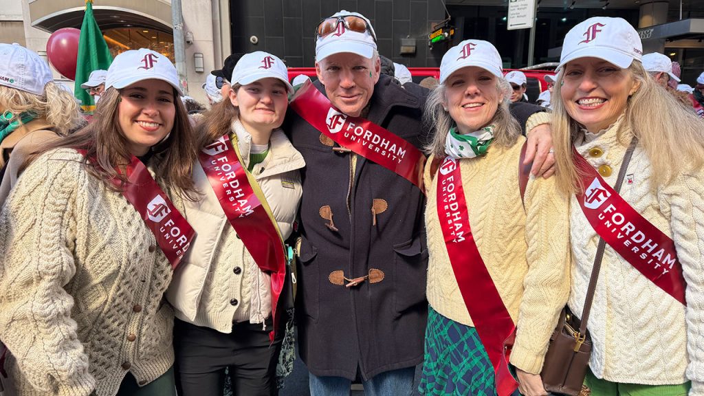 A family poses for a photo at the parade