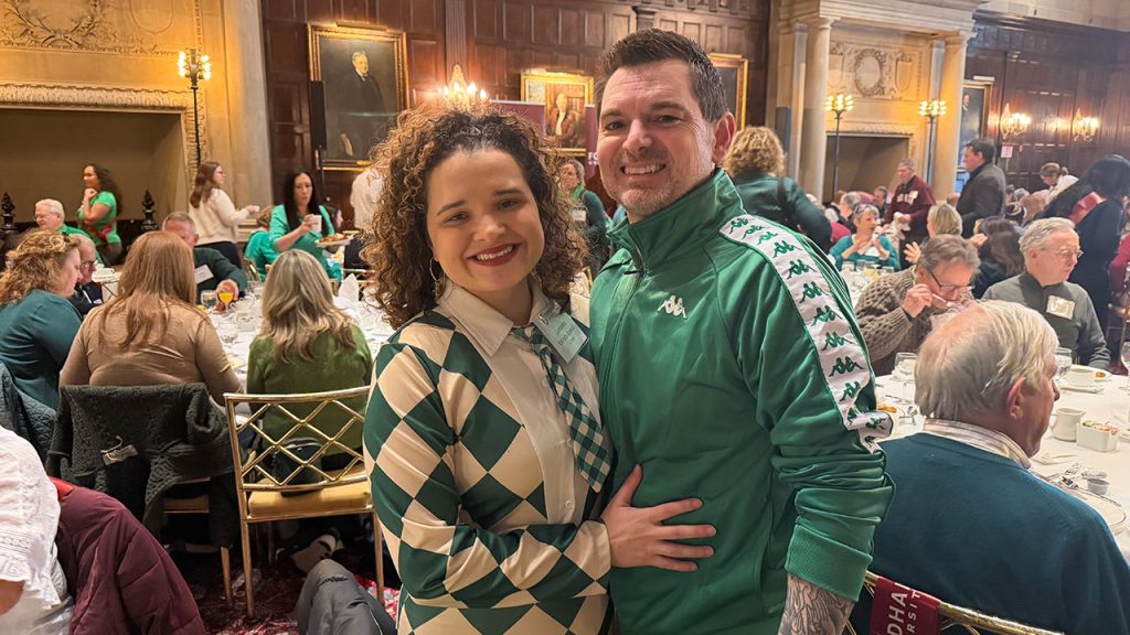 A couple pose for a photo