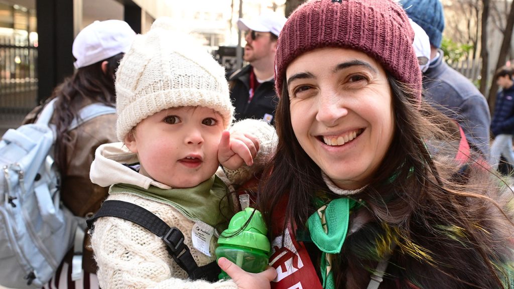 A woman poses with her baby