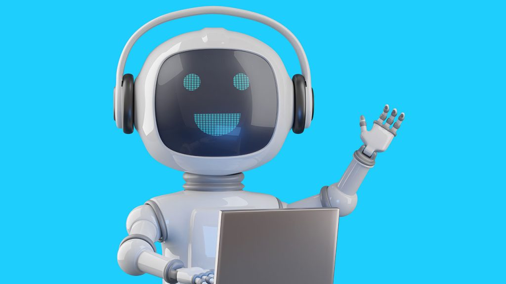 A robot waves while typing on a computer
