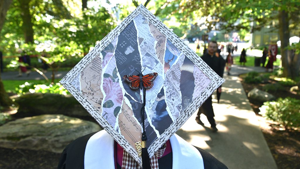 Commencement cap showing a design with a butterfly in the center