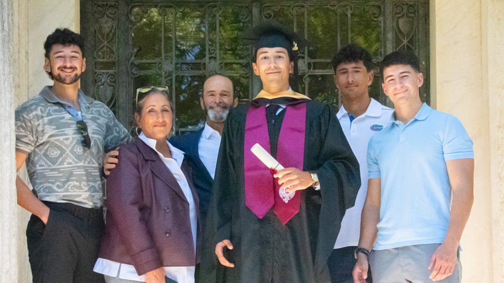 Christopher Lawson De Martini Williams with family members after earning his master's degree in real estate development from Fordham PCS.