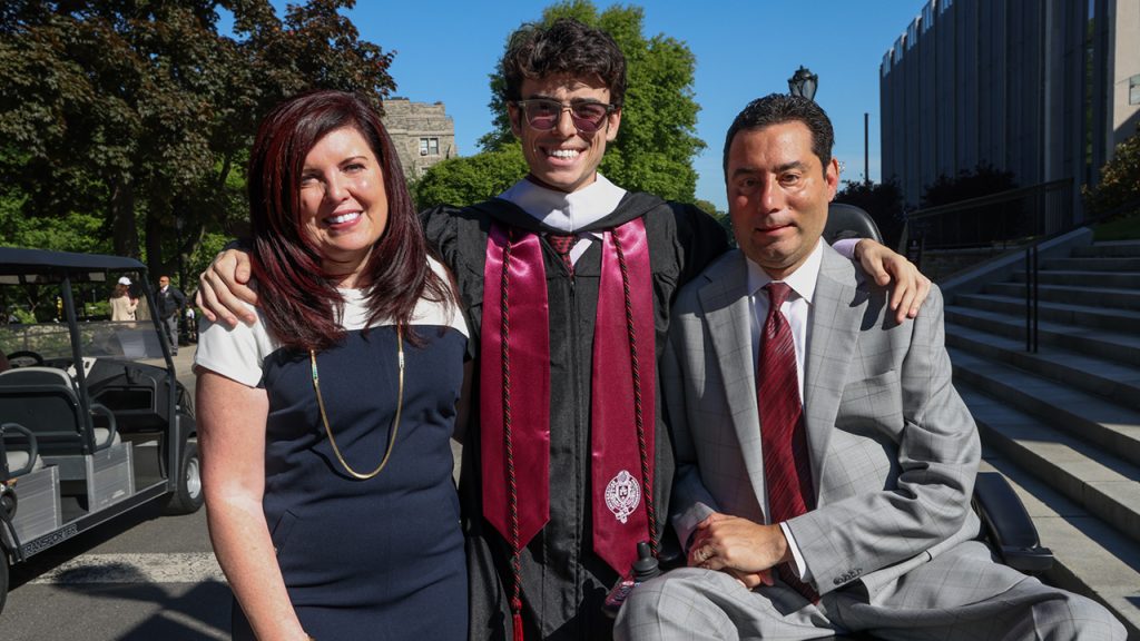 Three people pose for a photo