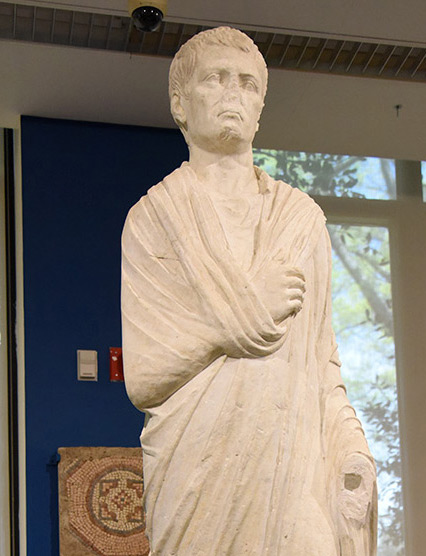 Statue of a Roman man wearing a Greek-style garment