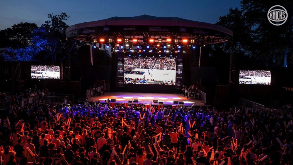 Fordham Lights Up for the Knicks A crowd watches the Knicks play at a Summer Stage event in NYC