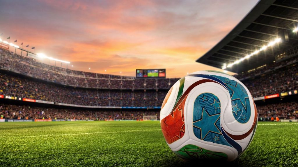A soccer ball on a soccer pitch representing the World Cup