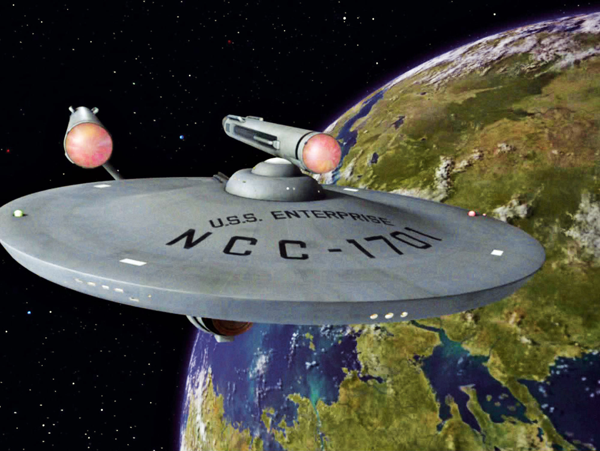 The original starship USS Enterprise NCC-1701 from Star Trek flying through outer space with a planet visible in the background.