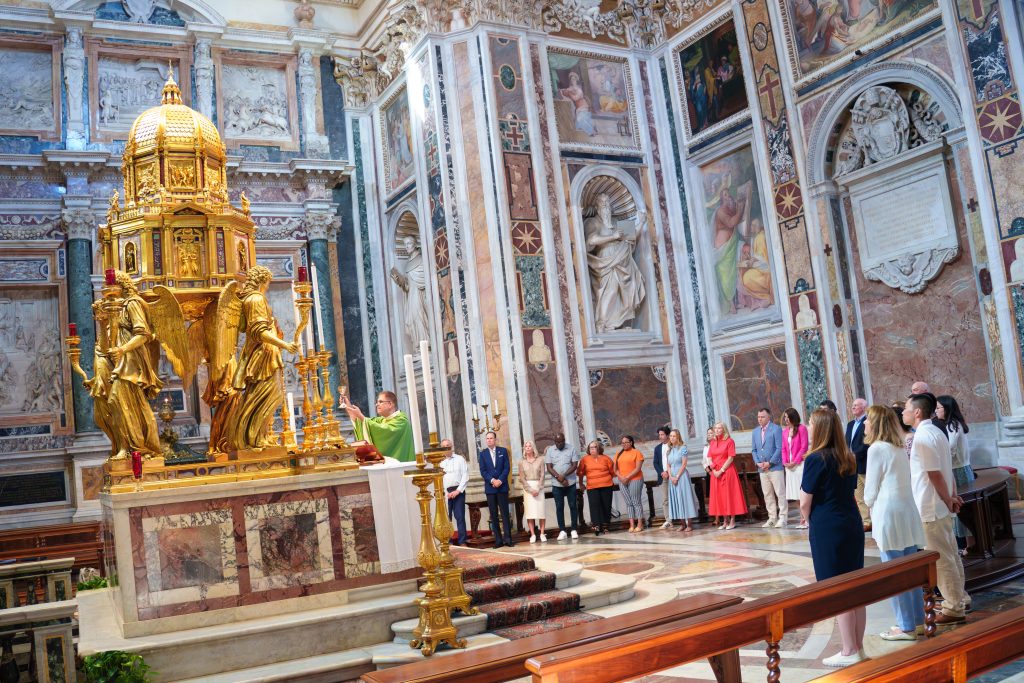 People celebrating Mass at the Basilica of Santa Maria Maggiore