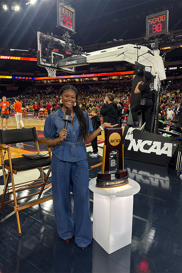 Young posing with the championship trophy at the 2026 NCAA men’s Final Four in Indianapolis. Photo by TKTKTKTK