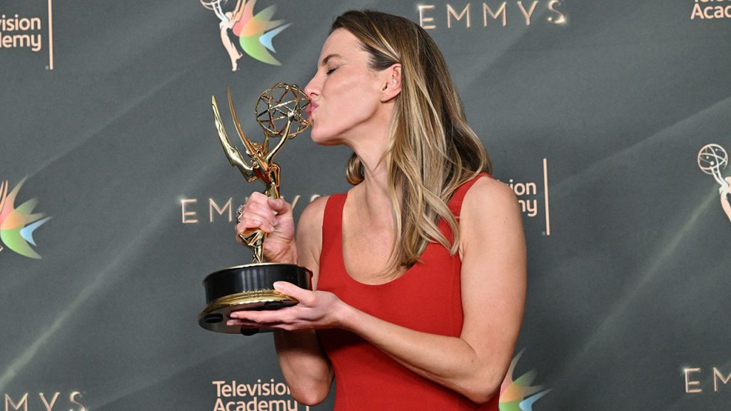 Betty Gilpin Rhymes with First Emmy Win Betty Gilpin kisses Emmy award