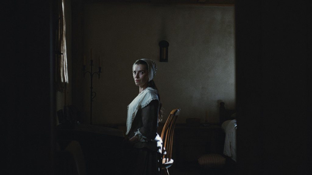 production still of Betty Gilpin as Sarah Westcott in Widow's Bay