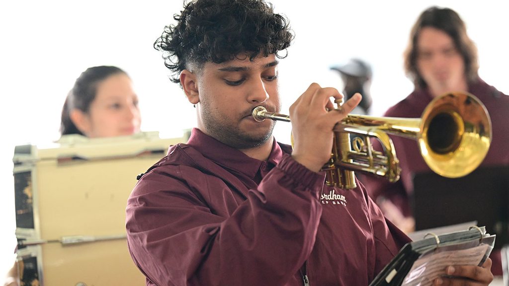 young man playing trumpet