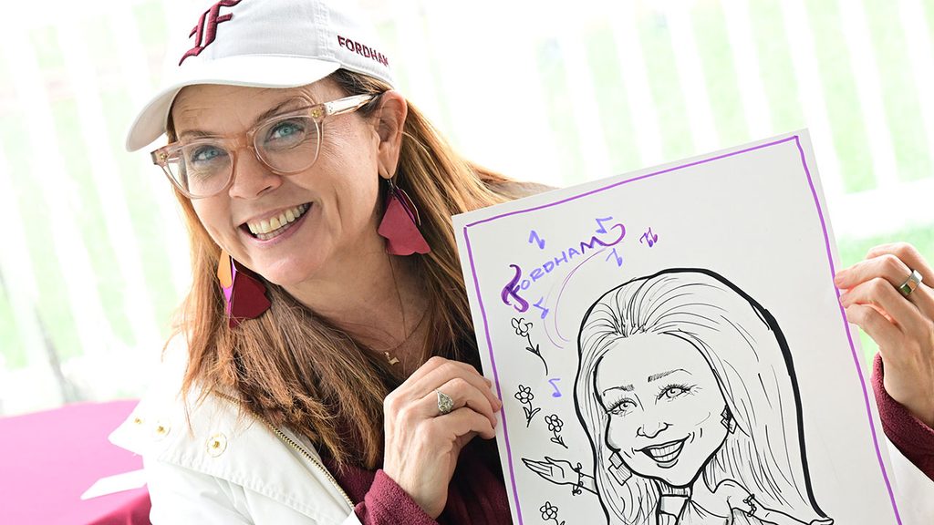Tania Tetlow holding up a caricature of herself