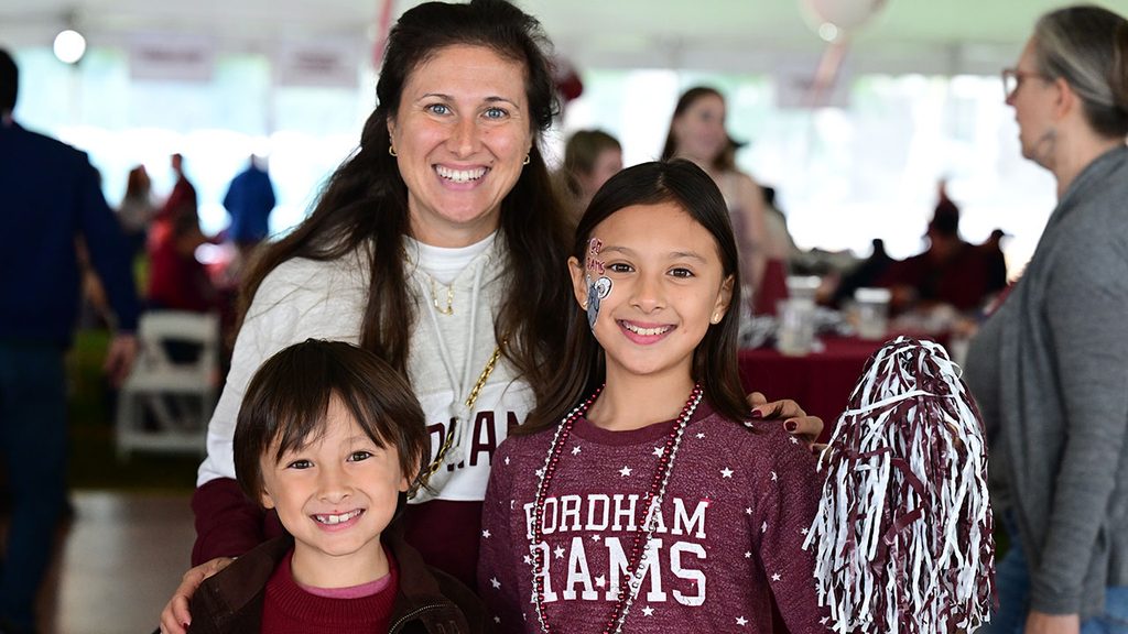 mom and two kids smiling